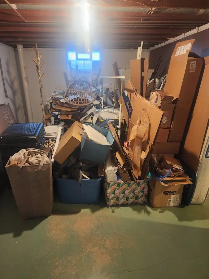 Roll-off dumpster container at job site for Yard Waste Dumpster Rental in Woodbury